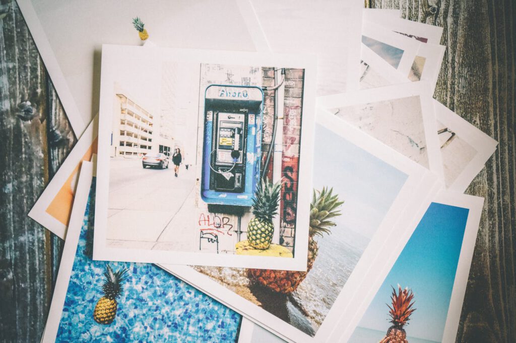 pexels-photo-191429 Vintage-style travel photo prints with a nostalgic feel on a wooden surface.